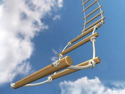 a rope ladder against a blue sky